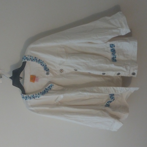 White jean jacket adorned with blue rhinestone like pieces. - Picture 1 of 6